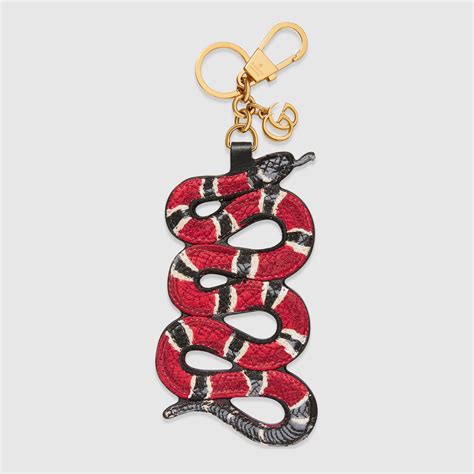 fake gucci snake keychain|gucci counterfeit purse.